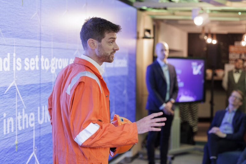 TechX image. Features a founder presenting at a TechX demo day.