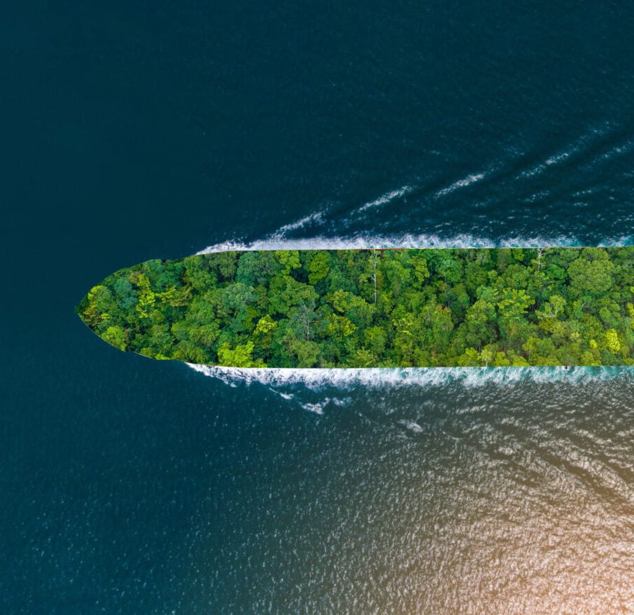 Container ship with green Leave. green transportation industry eco shipping for sustainable energy saving environmental low carbon. Express Cargo Container Ship with contrail in the ocean